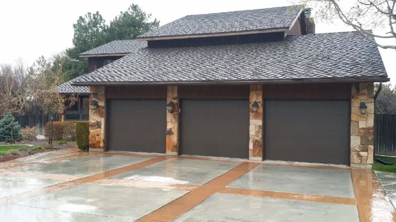 New garage door installation on a three-car garage